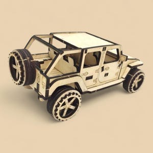 May include: A wooden model of a light-colored off-road vehicle with black accents. The model features a spare tire, detailed wheels, and a roof. The vehicle is constructed from interlocking wooden pieces.
