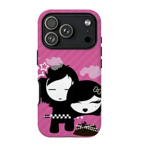 May include: Pink phone case with a cartoon illustration of two figures embracing. The case has a diagonal striped pattern and a black camera module. The figures are black and white, with one wearing a bow.