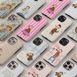 May include: A collection of phone cases with various designs featuring a cartoon monkey. The cases have different patterns, including stripes, stars, and floral prints. Some cases have the monkey in different outfits, and some have text.