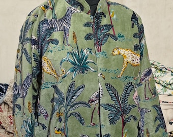 May include: A green jacket with a vibrant safari print featuring zebras, leopards, and birds amidst palm trees. The jacket has a mandarin collar and is displayed on a mannequin. The number 12 is visible on the mannequin's neck.