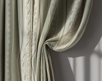 May include: Close-up of sage green and cream-colored striped curtains. The fabric features vertical stripes and a floral pattern along the edges. The curtains are draped, with a portion of the fabric folded over, revealing the texture and design.