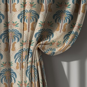 May include: Beige fabric with a repeating pattern of blue palm trees, orange leopards, and pink flowers. The curtain is draped, showing the detailed design. The fabric has a linen-like texture, suitable for home decor.