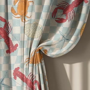 May include: Curtain panel with a light blue and white checkered pattern. The design features illustrations of red lobsters, orange crabs, seashells, and blue starfish. The curtain is partially draped, revealing the pattern.
