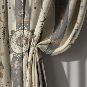 May include: Curtains with a celestial design featuring moons, stars, and arrows in beige, gray, and brown. The fabric has a vertical striped pattern with detailed illustrations of celestial elements. The curtains are partially draped, showing the fabric's texture.
