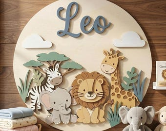 May include: A circular wooden wall plaque with the name "Leo" in blue script. It features a zebra, elephant, lion, and giraffe, with clouds and greenery. A children's room decoration.