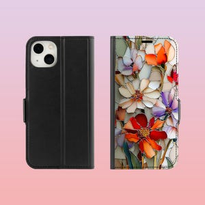 May include: Black phone case with a floral design. The case is shown open and closed. The open case reveals a colorful floral pattern with red, orange, white, and purple flowers. The closed case is solid black.