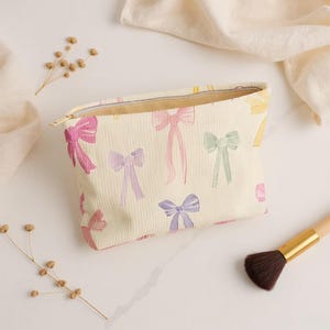 Cute Pastel Bow Corduroy Makeup Bag | Aesthetic Cosmetic Pouch | Zippered Travel Toiletry Organizer | Everyday Minimalist Beauty Bag