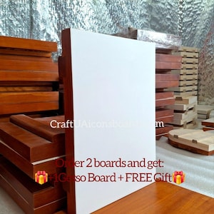 May include: A large, white gesso board with a brown wooden frame stands prominently, showcasing a clean, blank surface. The text "CraftUAiconsboard.com" is visible. The image also includes stacks of wooden boards and the text "Order 2 boards and get: +1 Gesso Board + FREE Gift".