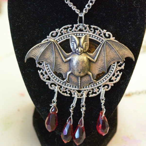 Halloween bat on cameo mount red tear drop crystal dangles at bottom spooky goth fantasy necklace 24 in chain