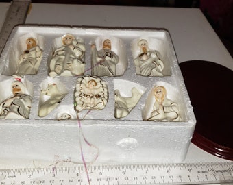 Porcelain 11 piece nativity with wood display excellent condition Christmas decor