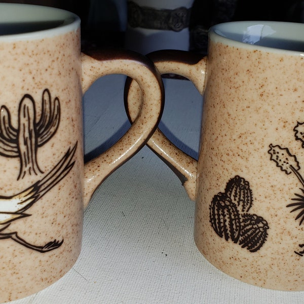 2 coffee cups Roadrunner and Cactus brown glaze excellent condition