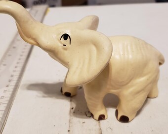 Cream colored vintage elephant figurine trunk up ceramic excellent condition