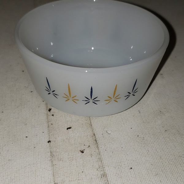 Fire king custard dish with atomic design.  In excellent condition