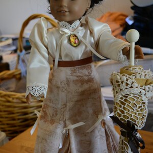 dolll clothes Victorian skirt box pleats ribbons crystals cream colored blouse cameo parasol vintage doily