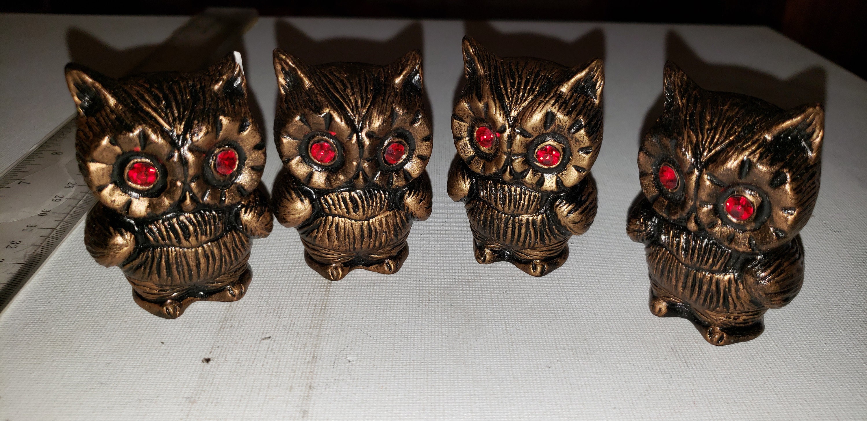 4 Ceramic owls with gem eyes one chipped good condition