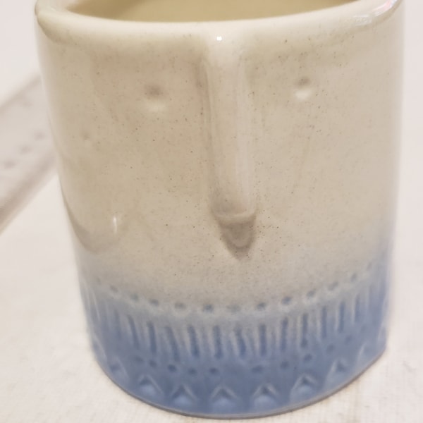 Tiny ceramic planter with face.  In excellent condition