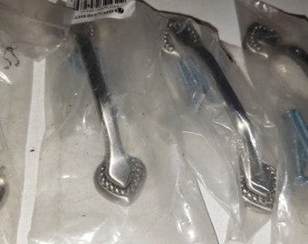 Set of 4 metal silver color drawer pulls handles new in package excellent condition