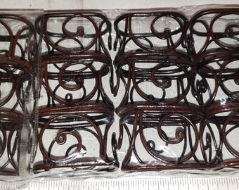 Set of 12 metal napkin rings in original package.  excellent condition