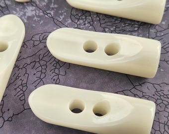 40 mm crème/ivoormix (polyester) 1" en 1/2" schakelknoppen