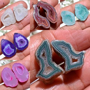 May include: A collection of six pairs of polished agate geodes, each showcasing unique colors and patterns. The geodes are cut to reveal the crystalline interiors, with hues ranging from white and purple to pink and teal. The shapes vary, offering a diverse display of natural stone formations.
