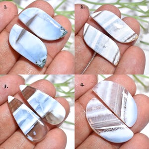 Puede incluir: Cuatro pares de cabujones de piedras preciosas pulidas de varias formas. Las piedras presentan tonos de azul, blanco y marrón, con patrones y texturas únicos. Los cabujones se sostienen en la mano de una persona, mostrando su tamaño y detalle.