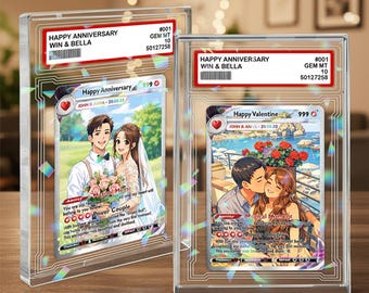 May include: Two collectible trading cards encased in clear protective slabs. The left card titled Happy Anniversary features a couple with flowers. The right card titled Happy Valentine shows a couple kissing. Both have red labels with text.