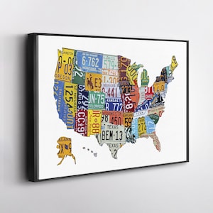 May include: A framed canvas art print featuring a map of the United States constructed from colorful license plates. The license plates are from various states, with a black frame and a white background.