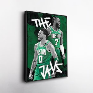 May include: A framed print featuring two basketball players in green jerseys with the text "BOSTON" and numbers. The background is green with white text that says "THE JAYS". The players are in action poses, with a black frame.
