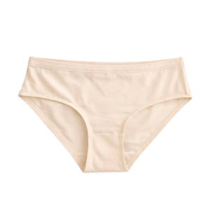 May include: A pair of solid beige bikini-style underwear featuring a smooth, seamless-looking fabric construction with a wide waistband and finished leg openings, providing a clean and simple design for everyday undergarment wear.
