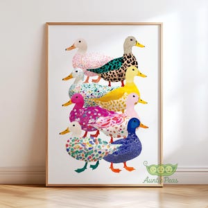 May include: A framed art print showing a tower of patterned ducks in various colours. The ducks have unique designs, including spots and floral patterns. The artwork is vibrant and cheerful, suitable for a child's bedroom or a playful space.
