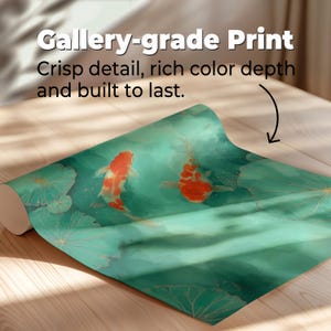 May include: A rolled-up print featuring two orange and white koi fish swimming in a teal pond with lily pads. The print has the text "Gallery-grade Print" and "Crisp detail, rich color depth and built to last."
