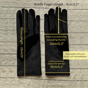 May include: A pair of black gloves with text overlays indicating a glove length of 9 inches, a middle finger length of 3.5 inches, a palm circumference of 6.3 inches, a cuff circumference of 6.3 inches, and a stretchable cuff up to 9.4 inches.
