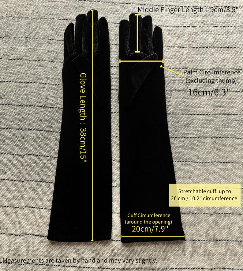 May include: A pair of black velvet opera gloves with a total length of 15 inches. The middle finger measures 3.5 inches, the palm circumference is 6.3 inches, the cuff circumference is 7.9 inches, and the cuff stretches up to 10.2 inches.