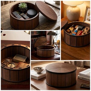 May include: A round wooden storage box with a dark brown finish and vertical paneling. The container features a removable circular lid with a radial grain pattern. The box is shown in various configurations, both open and closed, holding items.