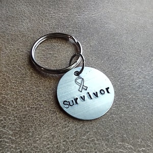 Hand stamped &quot;Cancer Survivor&quot; metal keychain