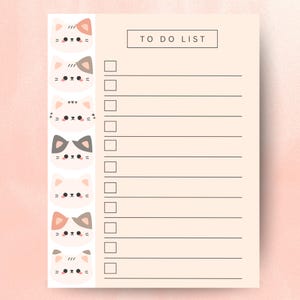 May include: A peach-coloured To Do List notepad featuring a vertical row of cartoon cat faces on the left. The notepad has a simple design with the words "TO DO LIST" at the top and blank checkboxes.