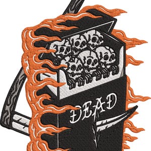 May include: Embroidered patch depicting a black cigarette packet with the word "DEAD" in white. The packet contains skulls and is surrounded by orange flames. A black and grey lighter is also present.