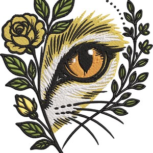May include: An embroidered design featuring a stylized eye with a yellow iris and black pupil, surrounded by yellow and white feathers. A yellow rose and green leaves frame the eye, with a dotted arc above.