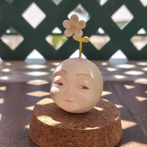 Baby face Air Dry Clay Figure with Smirky Smile & Daisy Flower