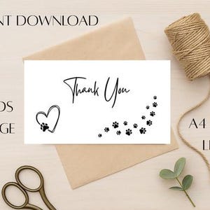 May include: A white card with the words "Thank You" in elegant script, a heart with a paw print, and paw prints. The card is on a beige envelope, with a spool of twine, scissors, and a sprig of greenery. Text reads "Instant Download", "9 Cards Per Page", and "A4 and US Letter".