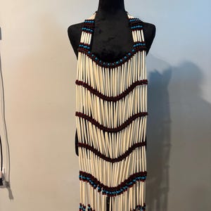 Women’s Breastplate , made with real bone, glass beads, shells and leather.