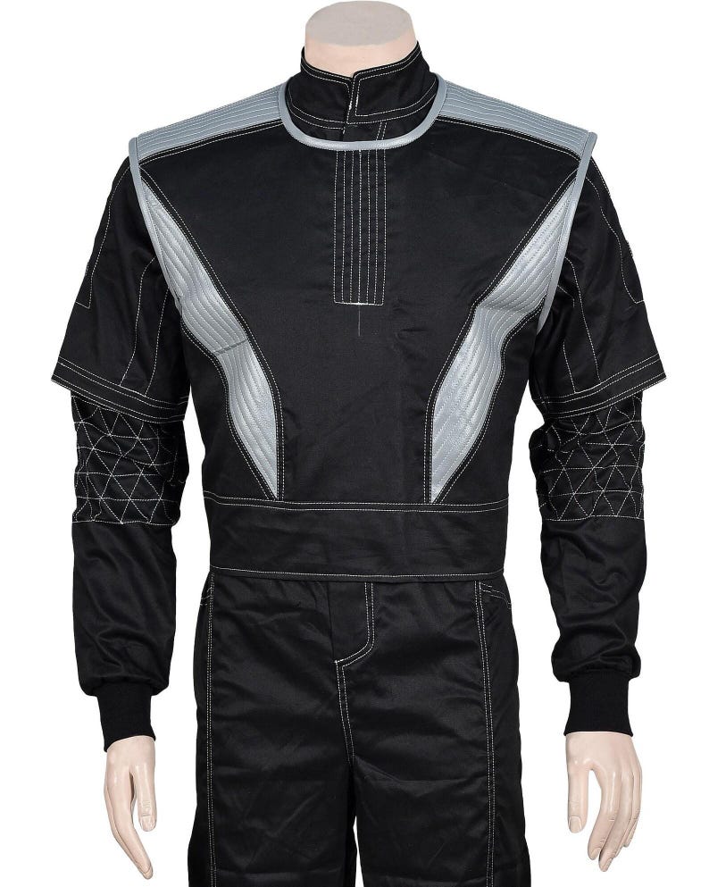 May include: Black racing suit with silver accents. The suit features a high collar, long sleeves, and a tailored fit. Silver panels are stitched on the chest and shoulders. White stitching details the seams and geometric patterns on the sleeves.