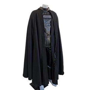 Side angle of Darth Vader leather cosplay costume, The Empire Strikes Back Star Wars cosplay suit showing detailed armor panels, shoulder pads, cape flow, gloves, belt, helmet, authentic replica outfit, ideal for cosplay events, Halloween, sci-fi conventions, fan photoshoots, collectors, and Star Wars themed costume parties