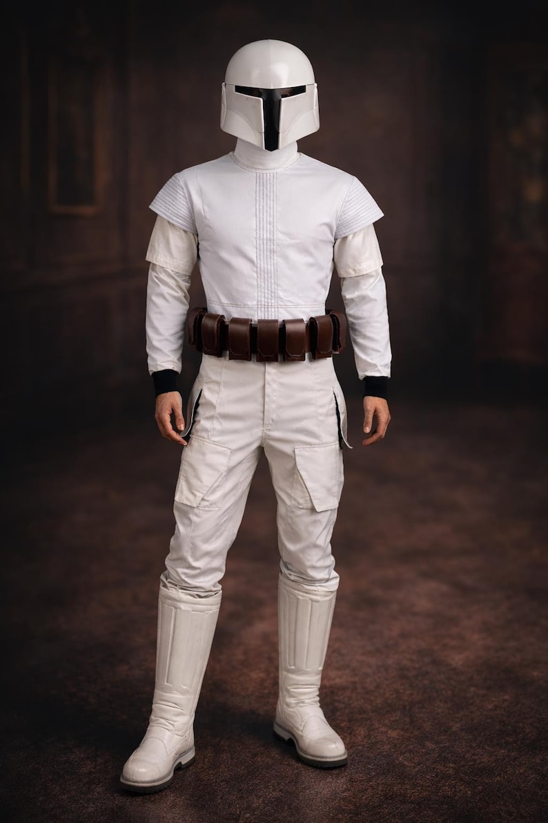 May include: A white costume with a helmet, long-sleeved shirt, pants, and boots. The costume includes a brown belt with pouches. The helmet has a black visor. The outfit is reminiscent of a science fiction or fantasy character.