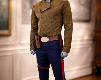May include: A brown suede jacket with an asymmetrical collar, paired with navy blue pants featuring a red stripe down the side. A brown leather belt with a gold buckle and a holster complete the outfit. The costume is displayed on a mannequin.