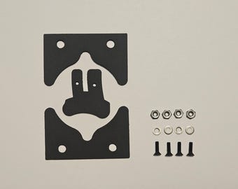May include: A collection of black, irregularly shaped gaskets with multiple holes, accompanied by nuts, washers, and screws. The components are arranged on a light-colored surface, likely for assembly.