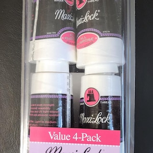 May include: A clear plastic package containing four spools of white Maxi-Lock all-purpose thread. Each spool has a black label with white text, a purple border, and a pink logo. The package is labeled "Value 4-Pack".