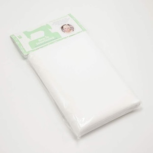 May include: A package of white sew-in interfacing. The packaging is white and green with the text "Sew-in Interfacing" and a picture of a woman. The interfacing is folded and wrapped in clear plastic.