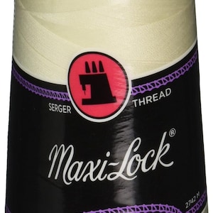 May include: A spool of Maxi-Lock serger thread in a light beige color. The label features the text "Maxi-Lock", "Serger Thread", and "All Purpose Spun Polyester". The spool contains 3000 yards of thread.