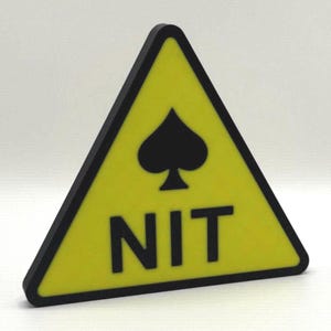 May include: A yellow triangular sign with a black border. The sign features a black spade symbol at the top and the word "NIT" in black block letters below. The sign is likely a warning or caution symbol.